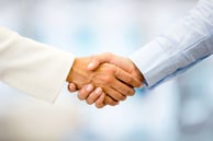 Successful business people handshaking closing a deal-1